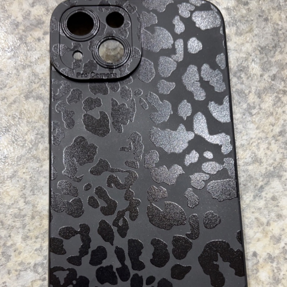 Black rubber leopard iPhone 13 case.